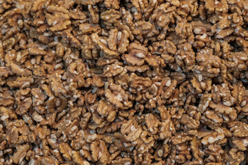 de-shelled walnuts. Large group of wallnut fruit background. Full Frame. Selective focus