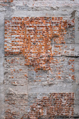 Unplastered brick wall of demolished, ruined building. demolition and rebuilding,