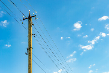 Power electric pole with line wire on colored background close up