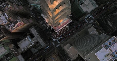 Birds eye overhead Chrysler Building with police lights and taxi street traffic