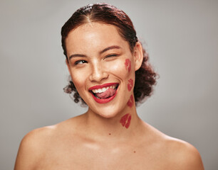 Beauty, face and woman lipstick and wink with kiss print on skin, flirt and sexy, tongue out isolated on studio background. Red, lips and smile with skincare, makeup mockup, fun and cosmetic care - obrazy, fototapety, plakaty