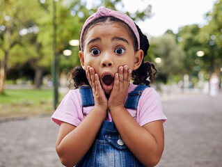 Wow, surprise and girl child at park outdoors looking shocked. Face portrait, omg and shock of kid from South Africa with surprised facial expression after good news while on holiday or vacation. - obrazy, fototapety, plakaty