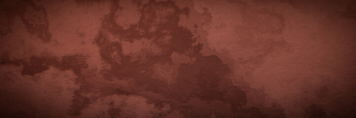 Red soil wall background. Weathered rock surface texture.