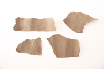 Set of torn cardboard pieces isolated on white background.