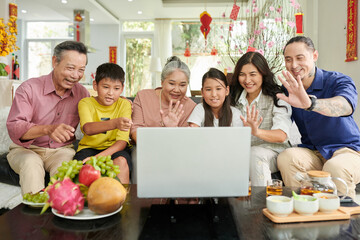Three generation family making video call on Chinese New Year
