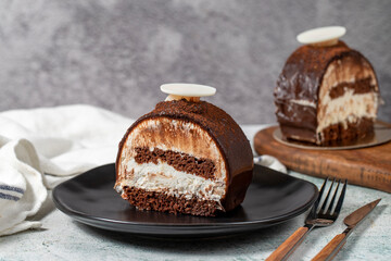 Layered Chocolate Cake on a Stone Background. A slice of delicious portion chocolate cake. close up