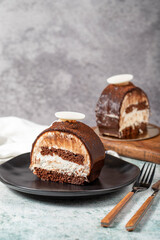 Layered Chocolate Cake on a Stone Background. A slice of delicious portion chocolate cake. close up