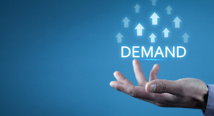 Male hand showing growing arrows and inscription Demand. Business