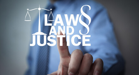Male hand showing Law and Justice concept.