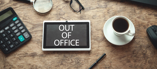 Out Of Office on tablet screen. Business concept