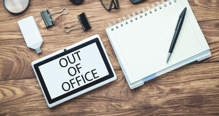Out Of Office on tablet screen. Business concept