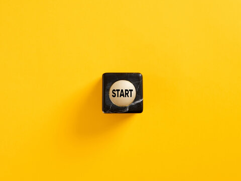 The word start on a marble cube. To make a new start in life, business, education or career concept. Start button.