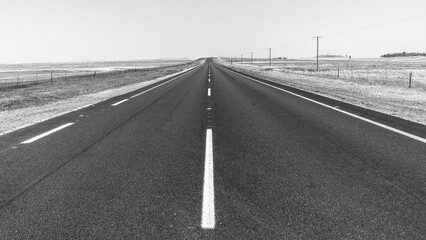 Road Highway Middle Center Straight Black White Horizon Countryside Landscape. - Powered by Adobe