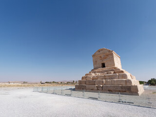 Tomb of Cyrus the Great with a clear blue sky in the background in Pasargadae near Shiraz, Iran