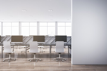 Contemporary spacious bright coworking office interior with blank mock up place on wall. Wooden and concrete materials. Panoramic window with city view and daylight. 