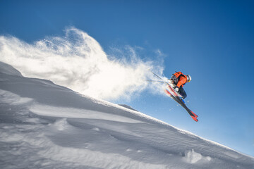 Naklejka na ściany i meble Skier in the sky during a jump