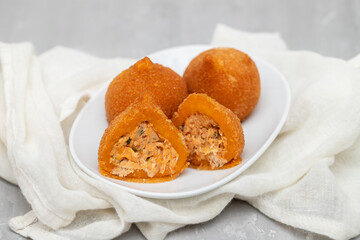 traditional brasilian fried drumsticks Coxinha de frango on dish