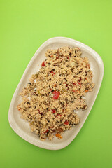Couscous with vegetables in a dish with fork