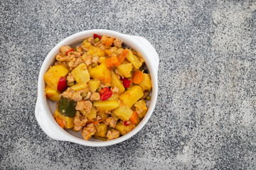 Vegan stew soy meat and vegetables in bowl