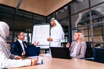 Multiracial group of corporate businesspeople working in a business office - Multiethnic...