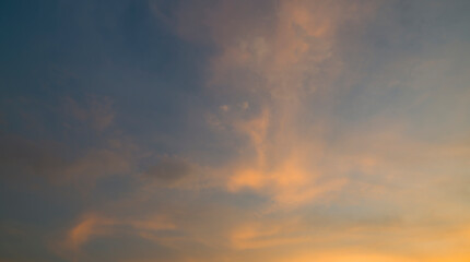 Naklejka na ściany i meble Dramatic clouds and sunset in the windy sky