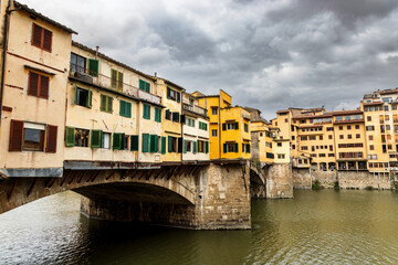Fototapeta na wymiar Ponte Vecchio in Florence, Tuscany, Italy, on cloudy day in spring.