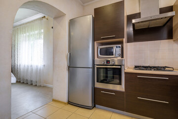 Interior of the modern luxure kitchen  in studio apartments in minimalistic style