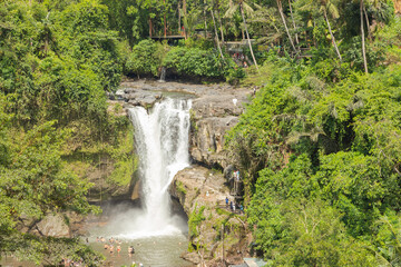 Tegenungan waterfall, Bali, Indonesia. Jungle, forest, daytime with cloudy sky.