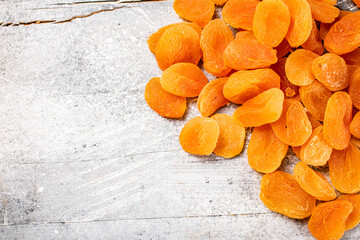 A pile of delicious dried apricots on the table. 