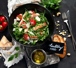 Chicken breast and fresh vegetable salad.