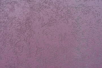 Texture of dusty purple wall with stucco worm finish