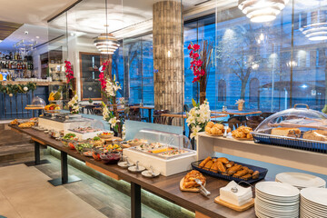 Restaurant interior with food buffet table