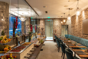 Restaurant interior with food buffet table