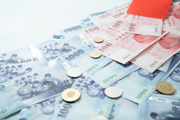 New Taiwan Dollar bill on white background. Red envelope packet chinese new year, hongbao on white background.
