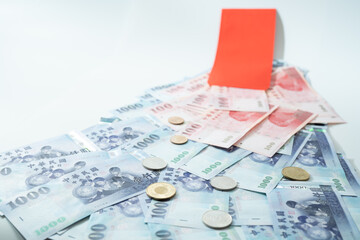 New Taiwan Dollar bill on white background. Red envelope packet chinese new year, hongbao on white background.