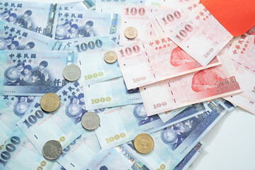 New Taiwan Dollar bill on white background. Red envelope packet chinese new year, hongbao on white background.