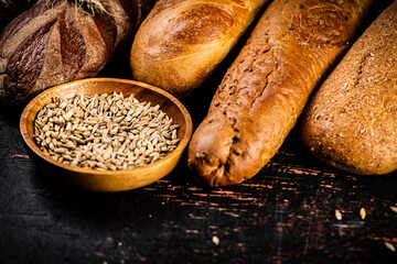 Various bread with grain in a bowl on the table. 