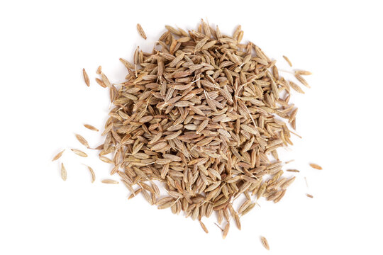 heap of natural dried cumin isolated on white background. view from above