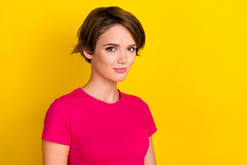 Fototapeta premium Photo of serious confident calm lady wear comfort bright clothes stand near empty space isolated on yellow color background