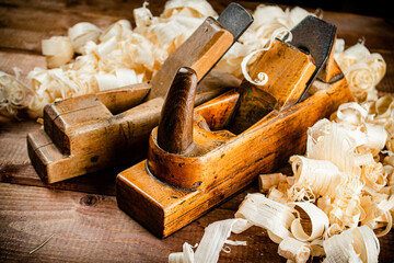Hand planer with wooden sawdust. 