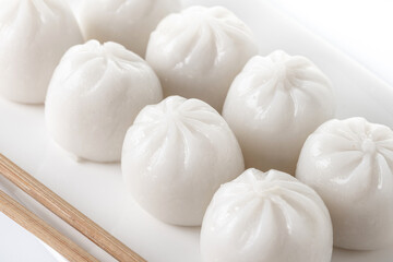 Fototapeta na wymiar Steamed dumplings isolated on white background. Traditional oriental food.