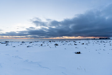 Naklejka premium Landscape of the area of the beach Black sand beach totally snowy at dawn