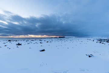 Landscape of the area of the beach Black sand beach totally snowy at dawn