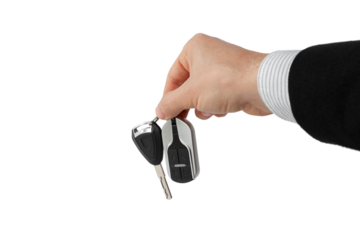 Businessman holding car key isolated on white