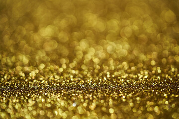 defocus bokeh blur gold golden dust spark glitter texture christmas abstract sparkle background. bokeh blur gold golden dust spark glitter texture sparkle background. gold golden bokeh 