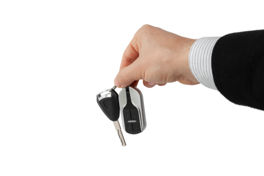 Businessman holding car key isolated on white