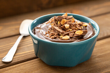 Chocolate pudding on a wooden table