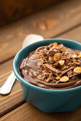 Chocolate pudding on a wooden table