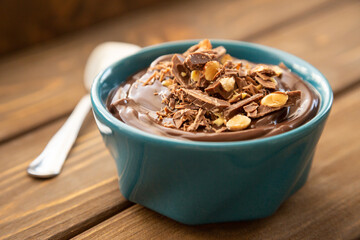Chocolate pudding on a wooden table