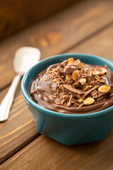Chocolate pudding on a wooden table